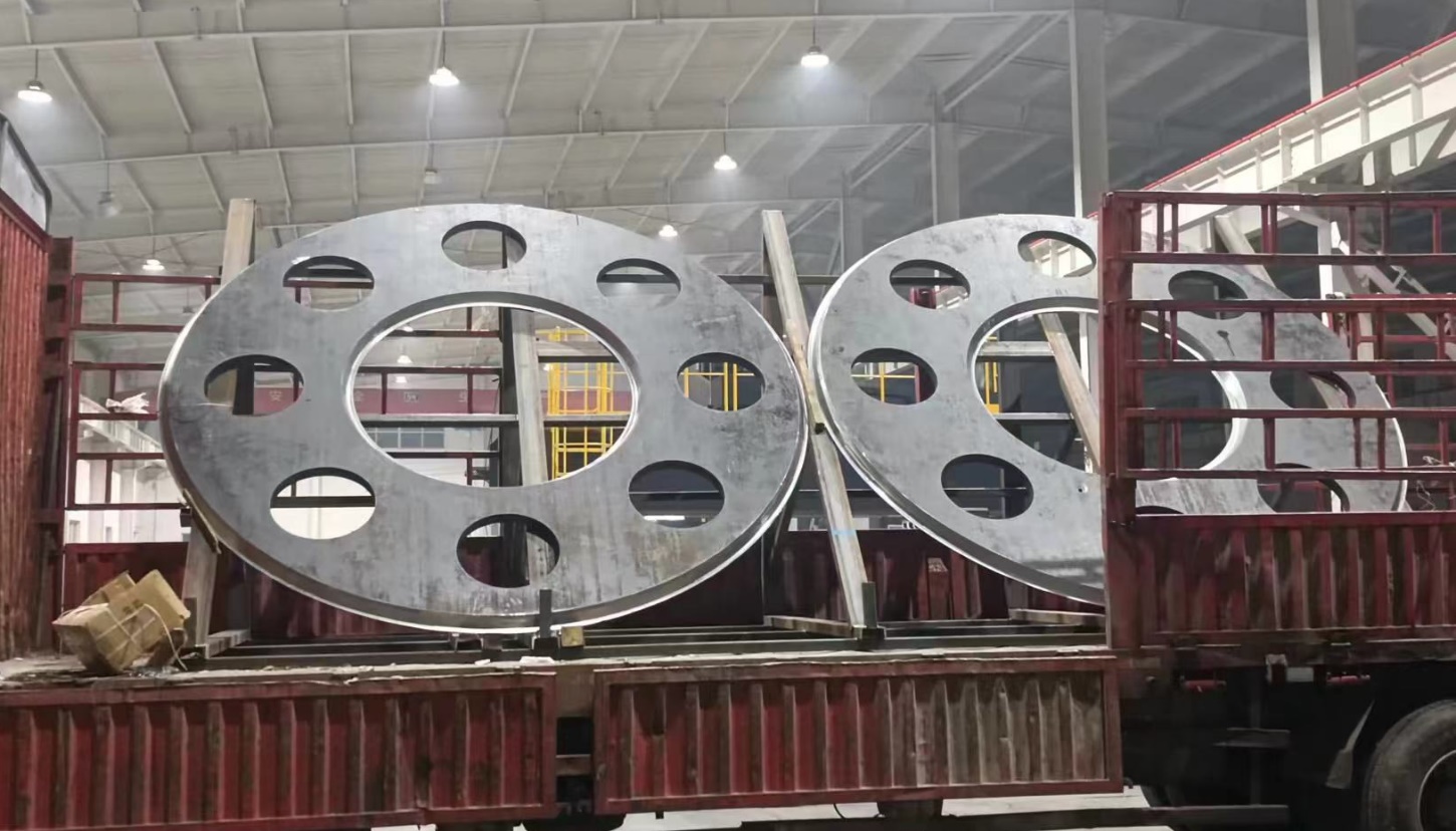 Large round steel components loaded on truck