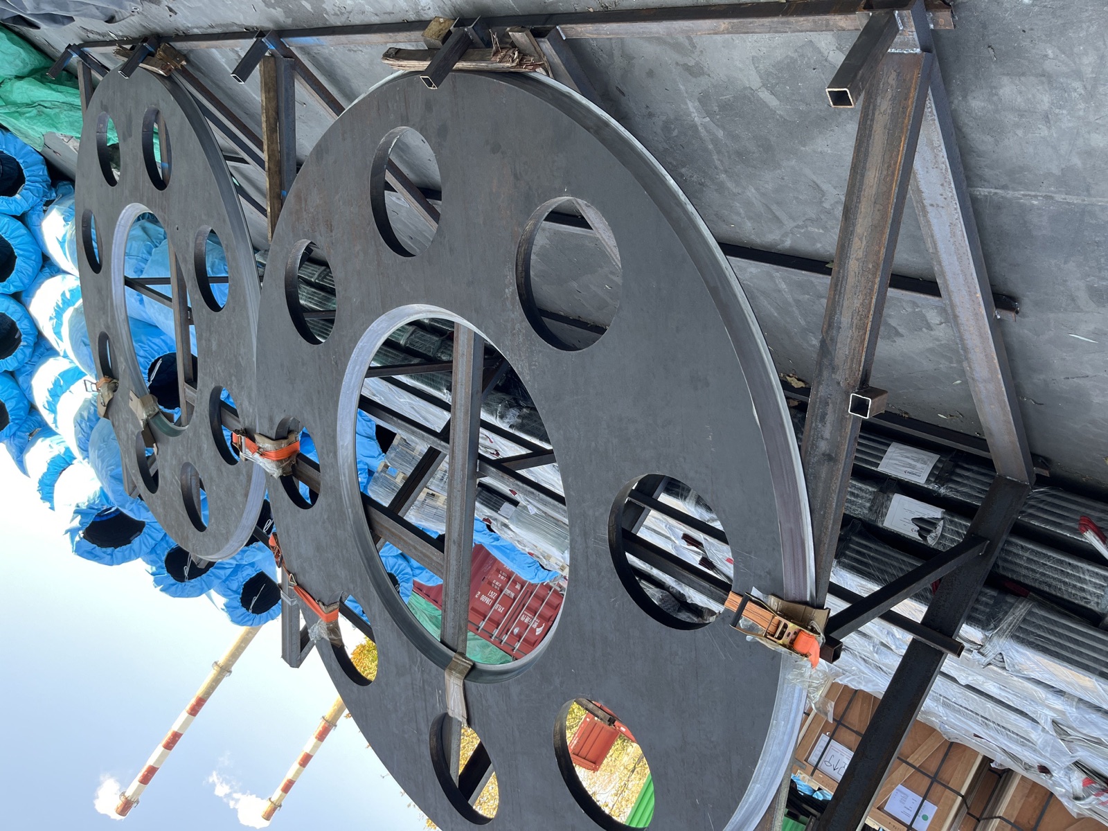 Steel web plates secured in a transport brace fixture